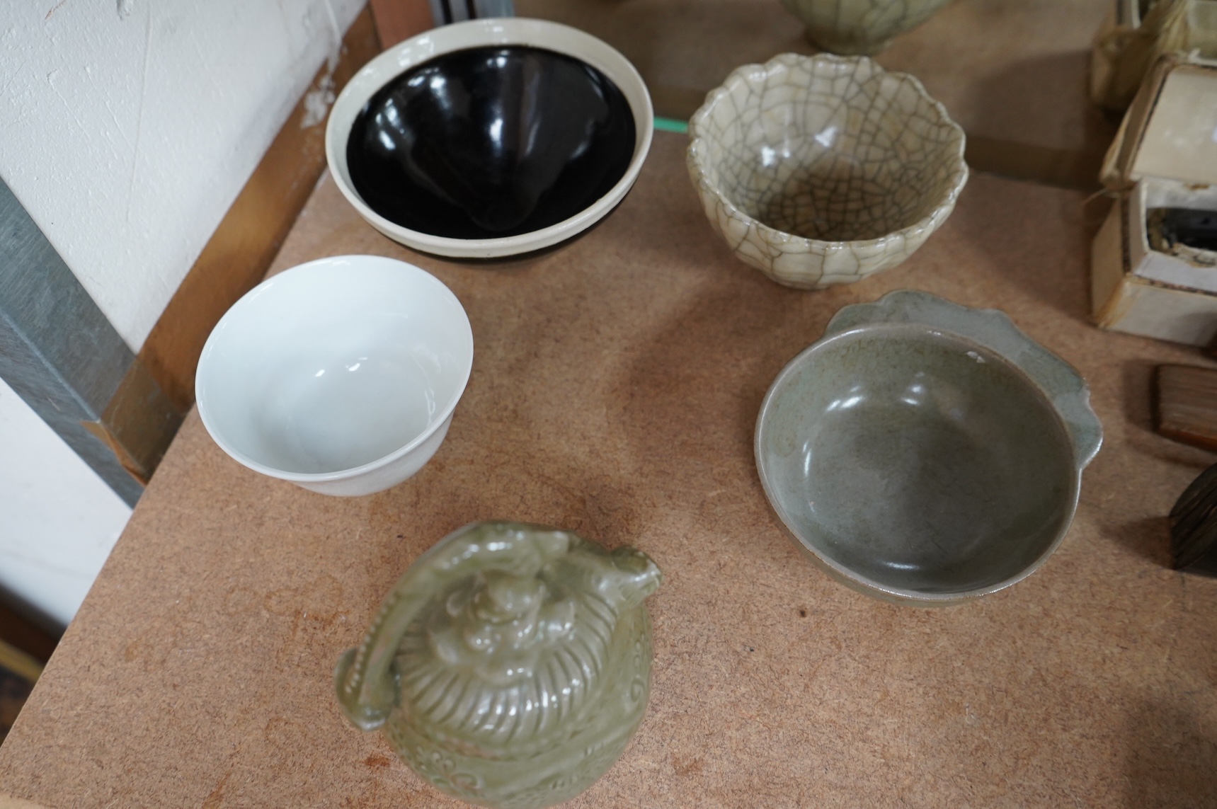 A collection of Chinese porcelain and pottery to include a naturalistic teapot, crackle glaze bowl and a ‘dragon’ bowl, largest 10cm in diameter